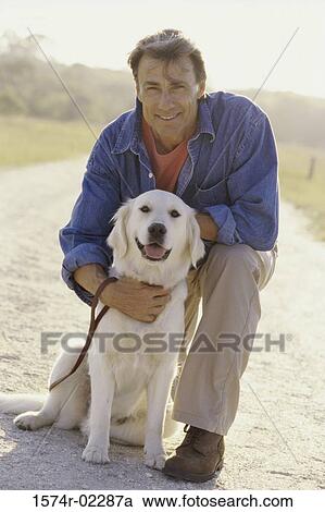 Portrait of a mid adult man hugging his dog View Large Photo Image Stock Image - Portrait of a mid adult man hugging his dog. Fotosearch