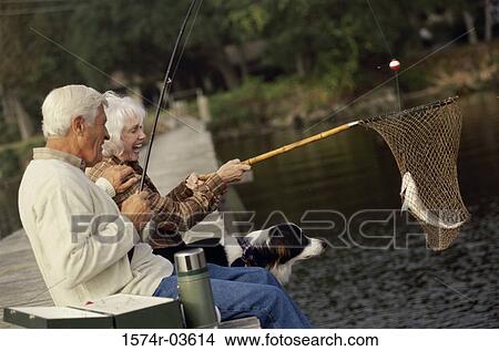 Side profile of a senior couple sitting on a dock fishing View Large Photo Image Picture - Side profile of a senior couple sitting on a dock fishing. Fotosearch