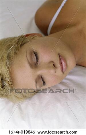 Close-up of a young woman sleeping View Large Photo Image Stock Photography - Close-up of a young woman sleeping. Fotosearch