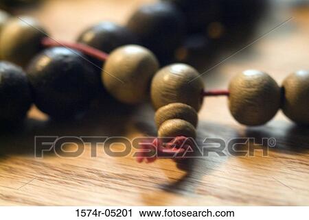 Stock Image - Close-up of a Buddhist prayer bracelet. Fotosearch