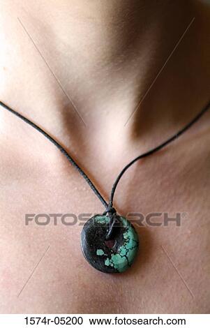 Close-up of a Buddhist prayer medallion around a person's neck View Large Photo Image Stock Image - Close-up of a Buddhist prayer medallion around a person's neck. Fotosearch