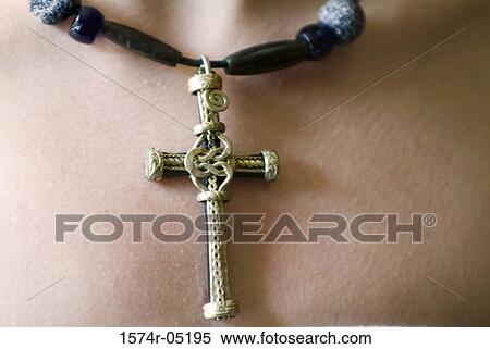 Close-up of a person wearing a cross around the neck View Large Photo Image Stock Photography - Close-up of a person wearing a cross around the neck. Fotosearch
