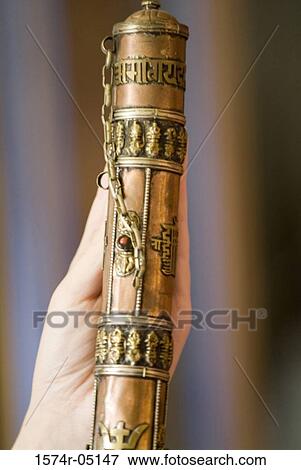 Close-up of a person's hand holding a Buddhist prayer sheath View Large Photo Image Stock Photo - Close-up of a person's hand holding a Buddhist prayer sheath. Fotosearch