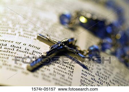 Close-up of a rosary on the Holy Bible View Large Photo Image Stock Photo - Close-up of a rosary on the Holy Bible. Fotosearch