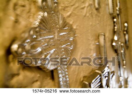 Close-up of crosses mounted on a wall View Large Photo Image Stock Photograph - Close-up of crosses mounted on a wall. Fotosearch