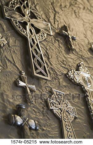 Stock Photography - Close-up of crosses mounted on a wall. Fotosearch