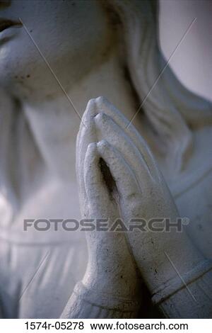 Close-up of folded hands of a statue of the Virgin Mary View Large Photo Image Stock Photo - Close-up of folded hands of a statue of the Virgin Mary. Fotosearch