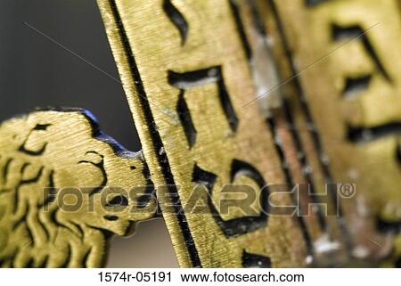 Close-up of Hebrew script on a menorah View Large Photo Image Stock Image - Close-up of Hebrew script on a menorah. Fotosearch