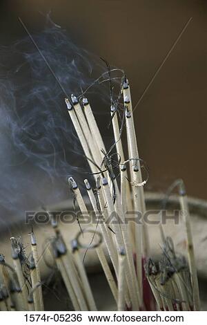 Close-up of incense sticks burning, Wat Suthat, Bangkok, Thailand View Large Photo Image Stock Photograph - Close-up of incense sticks burning, Wat Suthat, Bangkok, Thailand. Fotosearch