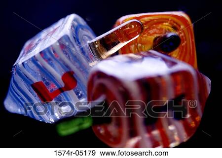 Close up of Jewish dreidels View Large Photo Image Stock Photo - Close up of Jewish dreidels. Fotosearch