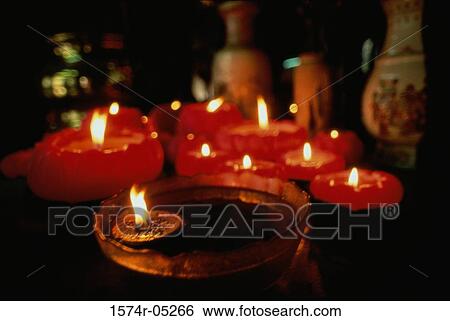 Stock Photograph - Close-up of lit candles, Man Mo Temple, Hong Kong, China. Fotosearch