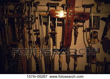 Crutches and crosses mounted on a wall, Santa Fe, Chimayo, New Mexico, USA View Large Photo Image Stock Photo - Crutches and crosses mounted on a wall, Santa Fe, Chimayo, New Mexico, USA. Fotosearch