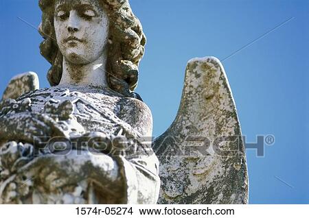 Low angle view of a statue of an angel View Large Photo Image Picture - Low angle view of a statue of an angel. Fotosearch