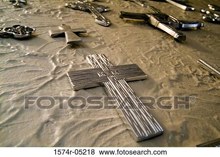 Low angle view of crosses mounted on a wall View Large Photo Image Stock Photo - Low angle view of crosses mounted on a wall. Fotosearch