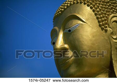 Stock Photo - Side profile of the face of a Buddha statue, Hong Kong, China. Fotosearch