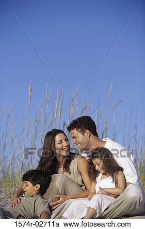 Parents with their son and daughter on the beach View Large Photo Image Stock Image - Parents with their son and daughter on the beach. Fotosearch