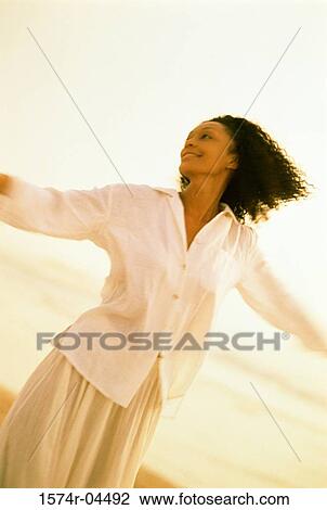 Young woman stretching her arms View Large Photo Image Stock Image - Young woman stretching her arms. Fotosearch