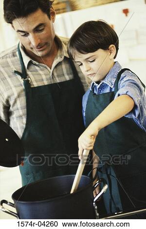 Boy cooking with his father View Large Photo Image Stock Image - Boy cooking with his father. Fotosearch