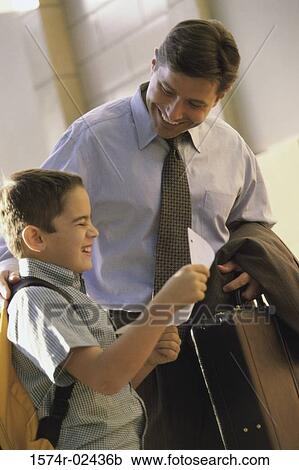 Boy laughing with his father View Large Photo Image Stock Image - Boy laughing with his father. Fotosearch