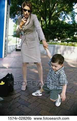 Boy tugging his mother by her hand View Large Photo Image Stock Image - Boy tugging his mother by her hand. Fotosearch