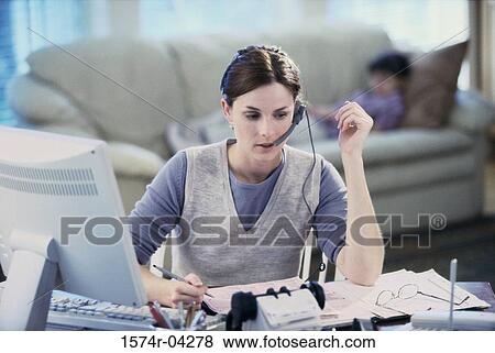 Businesswoman talking on a headset View Large Photo Image Stock Photo - Businesswoman talking on a headset. Fotosearch