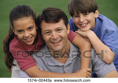 Close-up of a father with his son and daughter View Large Photo Image Stock Image - Close-up of a father with his son and daughter. Fotosearch