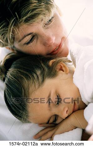 Close-up of a mother sleeping with her daughter View Large Photo Image Stock Image - Close-up of a mother sleeping with her daughter. Fotosearch