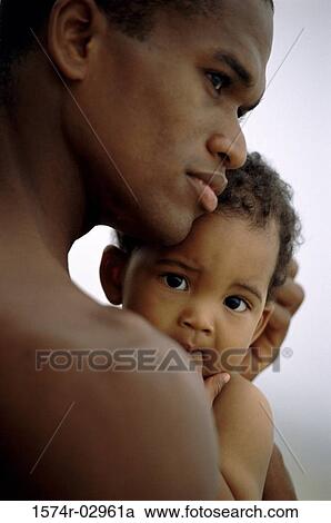 Father carrying his baby boy View Large Photo Image Stock Image - Father carrying his baby boy. Fotosearch