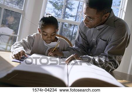 Picture - Father teaching his daughter. Fotosearch