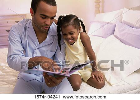 Stock Image - Father teaching his daughter. Fotosearch