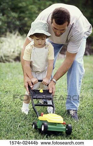 Father teaching his daughter to mow a lawn View Large Photo Image Stock Image - Father teaching his daughter to mow a lawn. Fotosearch