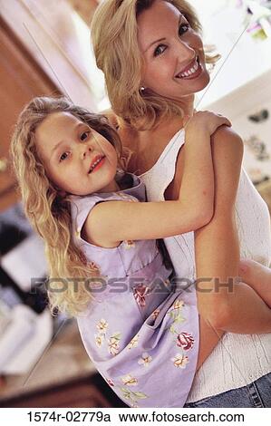 Girl riding piggyback on her mother View Large Photo Image Stock Image - Girl riding piggyback on her mother. Fotosearch