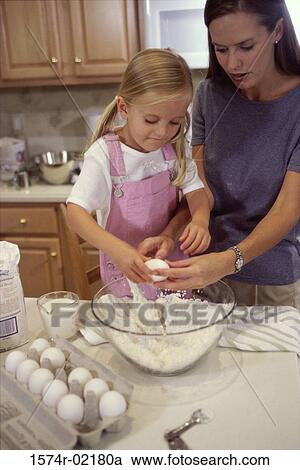 Mother and her daughter in the kitchen View Large Photo Image Stock Image - Mother and her daughter in the kitchen. Fotosearch