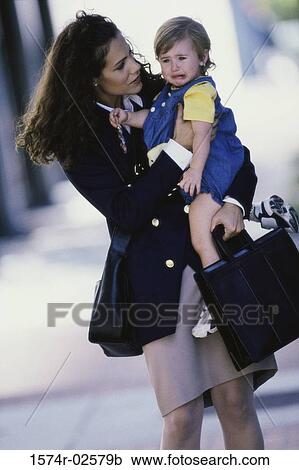 Mother carrying her daughter View Large Photo Image Stock Image - Mother carrying her daughter. Fotosearch