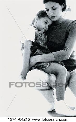 Mother hugging her daughter View Large Photo Image Stock Photography - Mother hugging her daughter. Fotosearch