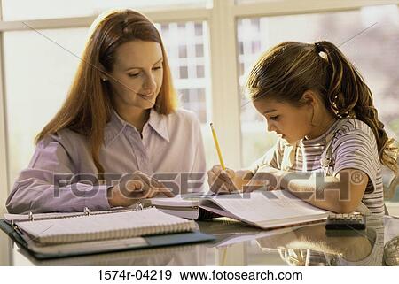 Mother teaching her daughter View Large Photo Image Stock Photo - Mother teaching her daughter. Fotosearch