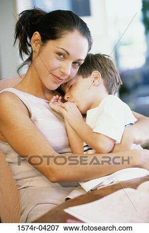 Portrait of a mother hugging her son View Large Photo Image Stock Photo - Portrait of a mother hugging her son. Fotosearch