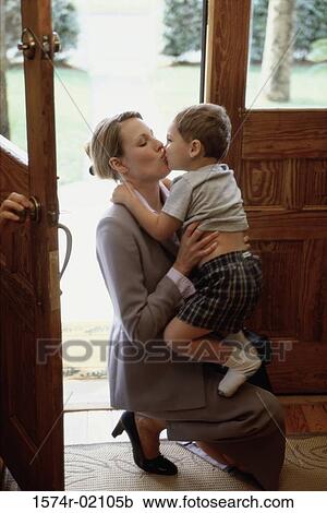 Side profile of a mother kissing her son View Large Photo Image Stock Image - Side profile of a mother kissing her son. Fotosearch
