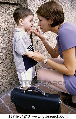 Side profile of a mother looking at her son View Large Photo Image Stock Image - Side profile of a mother looking at her son. Fotosearch