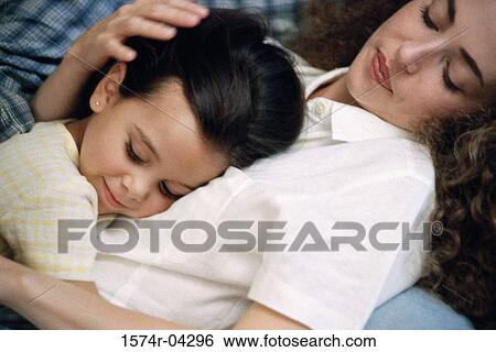 Side profile of a mother sleeping with her daughter View Large Photo Image Stock Photograph - Side profile of a mother sleeping with her daughter. Fotosearch
