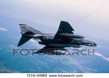 Aerial view of an F-4 Phantom II in flight View Large Photo Image Stock Photo - Aerial view of an F-4 Phantom II in flight. Fotosearch