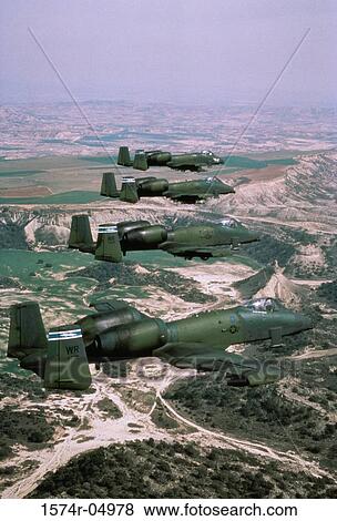 Stock Photo - Aerial view of four A-10 Thunderbolts flying in formation. Fotosearch