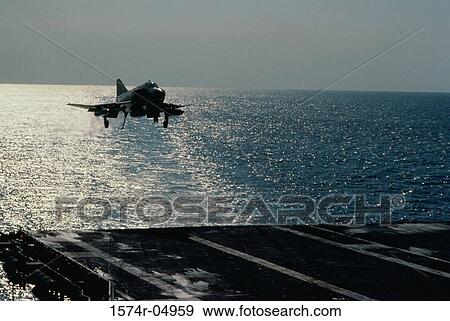 Fighter plane landing on the USS Midway aircraft carrier View Large Photo Image Stock Photo - Fighter plane landing on the USS Midway aircraft carrier. Fotosearch