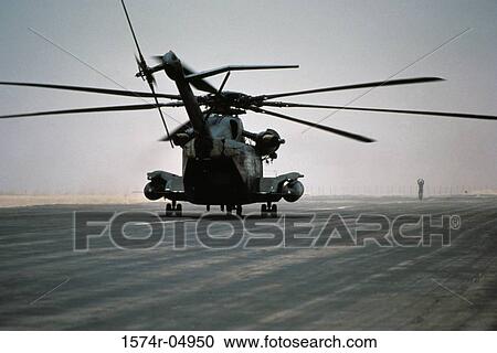 Ground crewman directing a CH-53E Super Stallion helicopter on a runway, Hurghada, Egypt View Large Photo Image Stock Image - Ground crewman directing a CH-53E Super Stallion helicopter on a runway, Hurghada, Egypt. Fotosearch