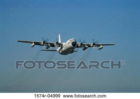Low angle view of a C-130 Hercules in flight View Large Photo Image Stock Photo - Low angle view of a C-130 Hercules in flight. Fotosearch