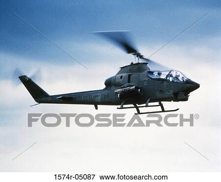 Low angle view of a military helicopter in flight View Large Photo Image Stock Photo - Low angle view of a military helicopter in flight. Fotosearch
