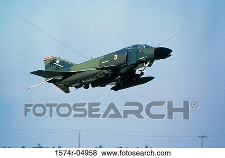 Stock Photo - Low angle view of an F-4G Phantom II fighter plane in flight. Fotosearch
