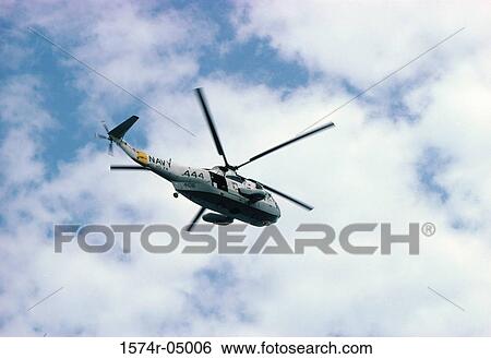 Low angle view of an SH-3D Sea King in flight View Large Photo Image Stock Photograph - Low angle view of an SH-3D Sea King in flight. Fotosearch