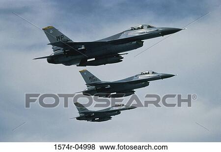 Low angle view of three F-16 Fighting Falcons flying in formation View Large Photo Image Stock Photo - Low angle view of three F-16 Fighting Falcons flying in formation. Fotosearch