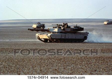 Picture - M-1 Abrams Main Battle Tank and M113 Armored Personnel Carriers in the Egyptian desert. Fotosearch